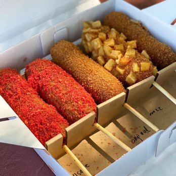 La Ca Bakery & Cafe - Rice Dogs (Korean Corn Dogs): Left to Right:  Sausage Cheetos, Mozzarella Cheetos, Original, Potato Mozzarella, Half Mozzarella. - Vietnamese Near Me - Hayward, California