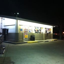 a car parked in front of a convenience store