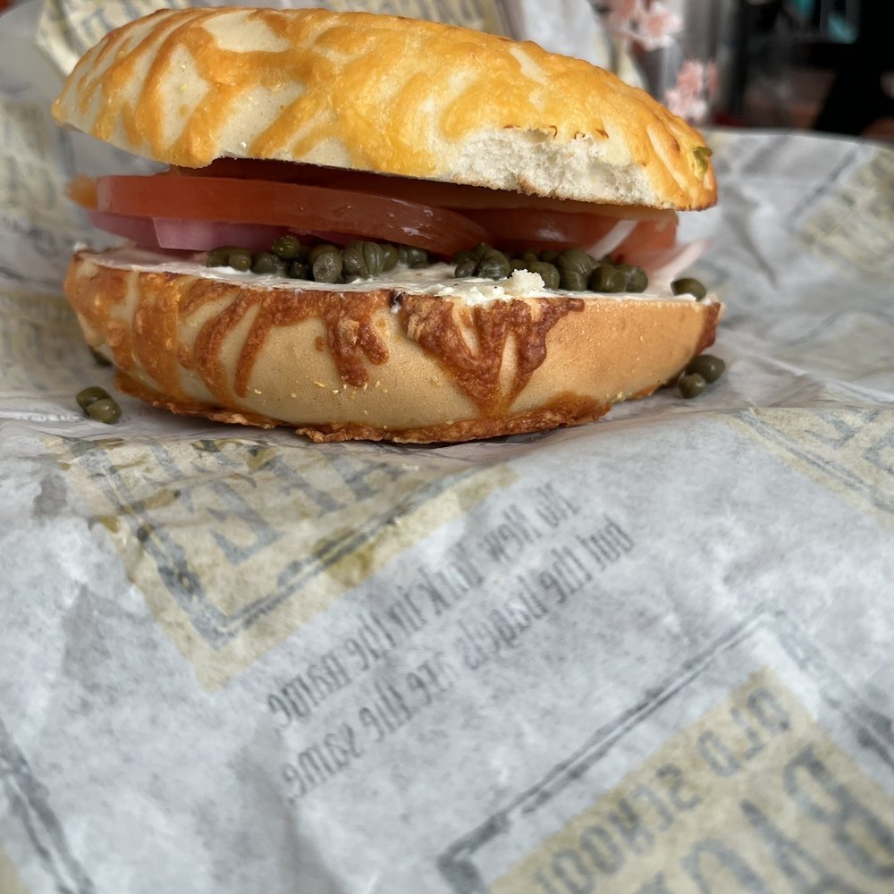 Old School Bagel Cafe - a sandwich on a newspaper - Cafes Near Me - Stillwater, Oklahoma