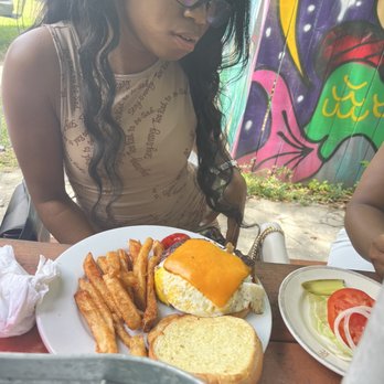 Woodchuck's Cafe - Me niece with the bacon wrapped burger - American Near Me - Tallahassee, Florida