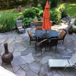 Ribsam's Landscapes - Natural random brownstone patio landscape