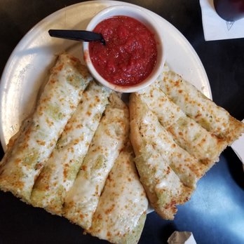 Bottoms Up Pizza - Mozzarella Tracks $8.75 Bread Tracks topped with melted mozzarella. Served with marinara sauce. - Pizza Near Me - Richmond, Virginia