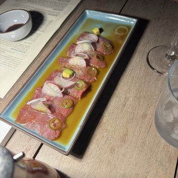 Quince - Thin slices of tuna sashimi with jalapeño and avocado. - International Near Me - San Miguel de Allende, GUA Quince - Thin slices of tuna sashimi with jalapeño and avocado. - International Near Me - San Miguel de Allende, GUA