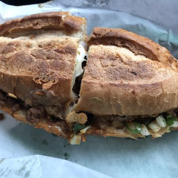El Primo - Breakfast Torta with Sausage, Egg and Cheese, cilantro and onions. A must try! - Tacos Near Me - Austin, Texas