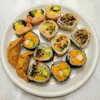 Komomo - a plate of sushi and other food items - Vegan Near Me - Montreal, Quebec Komomo - a plate of sushi and other food items - Vegan Near Me - Montreal, Quebec