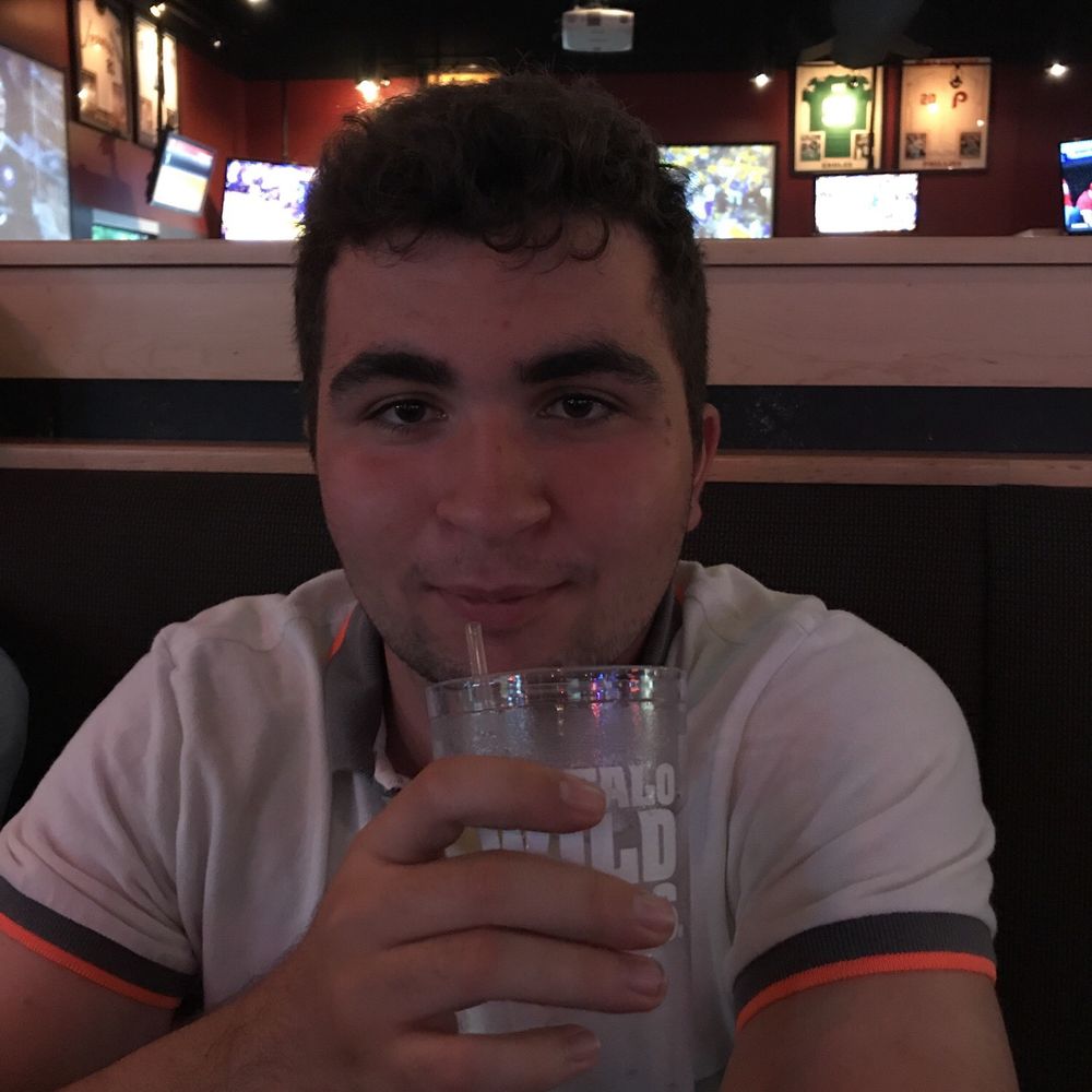 My friend enjoying a nice cold water served at Buffalo Wild Wings.