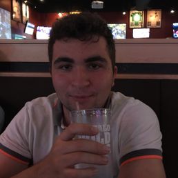 My friend enjoying a nice cold water served at Buffalo Wild Wings.