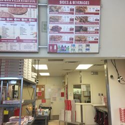 Papa Johns Pizza - Sides and beverages Sign along with the inside.