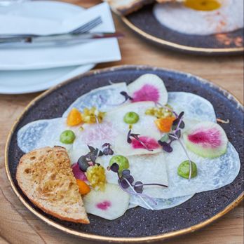 Kamúy - Carpaccio de jicama : Radis melon d'eau, physalis, vinaigrette au lulo, pain au chipotle, purée d'avocat - Caribbean Near Me - Montreal, Quebec Kamúy - Carpaccio de jicama : Radis melon d'eau, physalis, vinaigrette au lulo, pain au chipotle, purée d'avocat - Caribbean Near Me - Montreal, Quebec