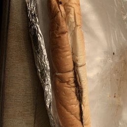 a hot dog wrapped in tin foil