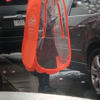 Chick-fil-A - Staff member taking our order in the rain. - Fast Food Near Me - Merrillville, Indiana