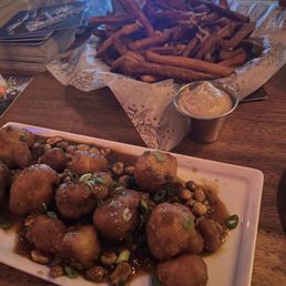Sweet potato fries (top) and Cauliflower bites (bottom. Sweet potato fries (top) and Cauliflower bites (bottom.