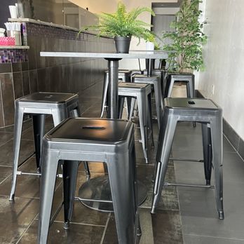 Fruit Shack - Seating includes tables with stools as well as a table with chairs, where I was sitting. - Juice Bars & Smoothies Near Me - Tucson, Arizona