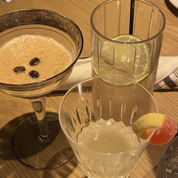 Surdyk's Sidebar - Espresso martini, side peach drink (bottom) and smash bang boom drink (top) - Bars Near Me - Minneapolis, Minnesota Surdyk's Sidebar - Espresso martini, side peach drink (bottom) and smash bang boom drink (top) - Bars Near Me - Minneapolis, Minnesota