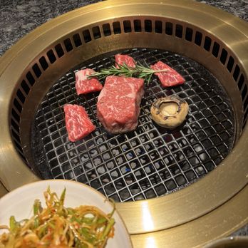 Seoul Prime - Dry aged ribeye surrounded by golbi pieces. Rosemary on top and a mushroom to join them. - Steakhouses Near Me - Falls Church, Virginia Seoul Prime - Dry aged ribeye surrounded by golbi pieces. Rosemary on top and a mushroom to join them. - Steakhouses Near Me - Falls Church, Virginia