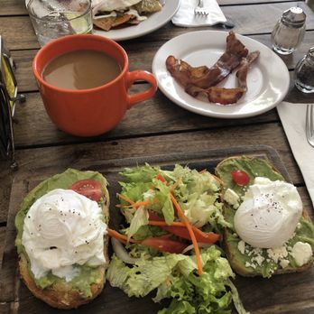 Cafe Mogagua - Avocado toast with poached eggs, side of bacon, cafe con leche. At the top of the photo: huevos rancheros (also bomb) - Mexican Near Me - Isla Mujeres, ROO Cafe Mogagua - Avocado toast with poached eggs, side of bacon, cafe con leche. At the top of the photo: huevos rancheros (also bomb) - Mexican Near Me - Isla Mujeres, ROO