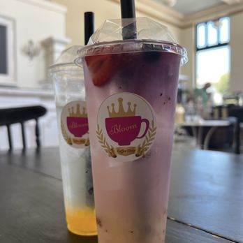 Bloom coffee shop - Mango tea with passion popping boba (pictured with water refill ;) and Mary Berry tea with Lychee popping boba. - Coffee & Tea Near Me - King City, California