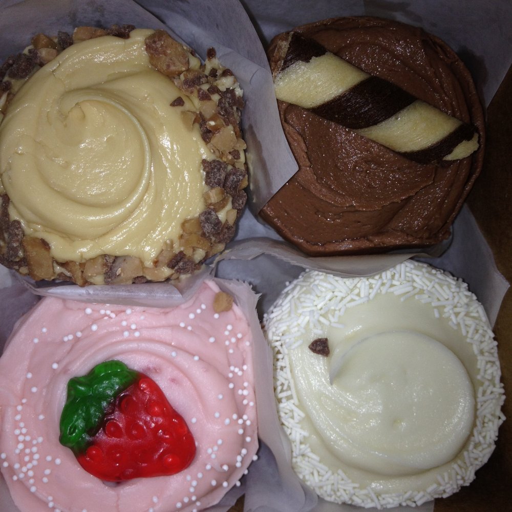 Frosted Cupcakery - Warning: My cupcakes traveled several hours on JetBlue so a little piece of chocolate touched my white choco cupcake. Still DELICIOSO! - Bakeries Near Me - Long Beach, California Frosted Cupcakery - Warning: My cupcakes traveled several hours on JetBlue so a little piece of chocolate touched my white choco cupcake. Still DELICIOSO! - Bakeries Near Me - Long Beach, California