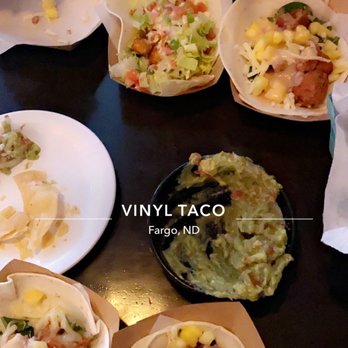 Vinyl Taco - mango chicken tacos (one buffalo chicken taco up in there as well) & chips + guac - Tapas/Small Plates Near Me - Fargo, North Dakota