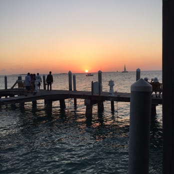 Latitudes - Sunset Key Cottages - Beautiful sunset from the ferry dock - Seafood Near Me - Key West, Florida Latitudes - Sunset Key Cottages - Beautiful sunset from the ferry dock - Seafood Near Me - Key West, Florida