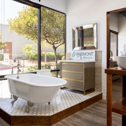 Faucets N Fixtures - Vanities and tubs are on display in full bathroom vignettes