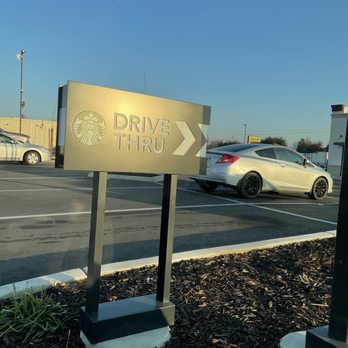 Starbucks - a drive thru sign in a parking lot - Coffee & Tea Near Me - Parlier, California Starbucks - a drive thru sign in a parking lot - Coffee & Tea Near Me - Parlier, California