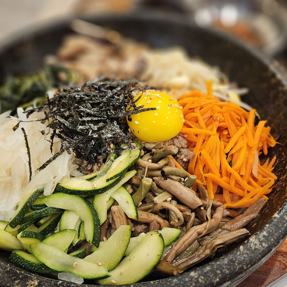 Damee Korean Restaurant - Solsot Bibimbab $20.95: Rice topped w/ 7 Namul, Beef, Egg Fry in Hot Stone Pot - Korean Near Me - Buena Park, California