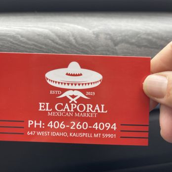El Caporal Mexican Market - a hand holding a business card - International Grocery Near Me - Kalispell, Montana El Caporal Mexican Market - a hand holding a business card - International Grocery Near Me - Kalispell, Montana