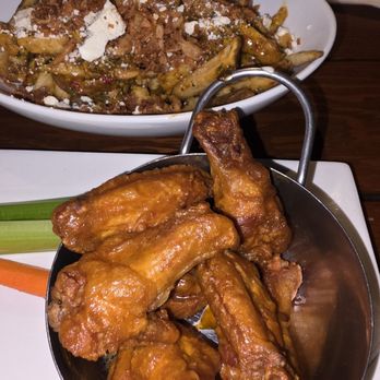 The Loose Moose - Garlic parmesan fries and chicken wings. - Sports Bars Near Me - Toronto, Ontario