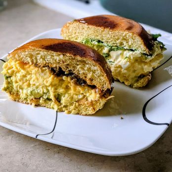 Egghole - Caramelized onions (front) and wasabi mayo with arugula (back) - Breakfast & Brunch Near Me - Kent, Washington Egghole - Caramelized onions (front) and wasabi mayo with arugula (back) - Breakfast & Brunch Near Me - Kent, Washington
