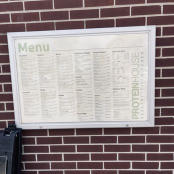 PROTEINHOUSE - a menu on a brick wall - Juice Bars & Smoothies Near Me - Kansas City, Missouri PROTEINHOUSE - a menu on a brick wall - Juice Bars & Smoothies Near Me - Kansas City, Missouri