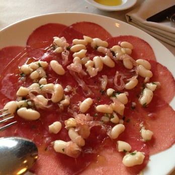 La Quercia - Steak carpaccio with white beans in a garlic dressing with sisters scallions. - Italian Near Me - Vancouver, British Columbia La Quercia - Steak carpaccio with white beans in a garlic dressing with sisters scallions. - Italian Near Me - Vancouver, British Columbia