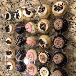 a variety of decorated cupcakes