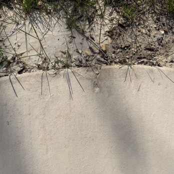 Kong Crete - Chips at the edge of the walkway - Masonry/Concrete Near Me - Mahomet, Illinois