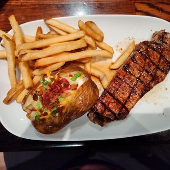 LongHorn Steakhouse - Ribeye with loaded, baked potato, and steak fries. - Steakhouses Near Me - Hanover, Maryland LongHorn Steakhouse - Ribeye with loaded, baked potato, and steak fries. - Steakhouses Near Me - Hanover, Maryland