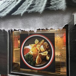 Miso Teriyaki House - Outside window looking in during the snow.