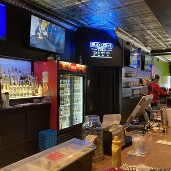 The Pitt - a restaurant with a bar and televisions - Burgers Near Me - Pittsburg, Kansas