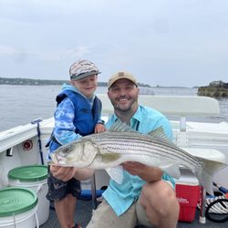 Casco Bay Adventures - Proud dad and son with striped bass.