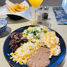 Chilaquilles and a Queens Margarita. Chilaquilles and a Queens Margarita.