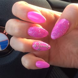 Mystique Tanning Salon - Calli's stiletto nails in Barbie pink