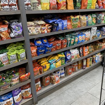 Village Square Market - a variety of snacks on shelves - Delis Near Me - New York, New York Village Square Market - a variety of snacks on shelves - Delis Near Me - New York, New York