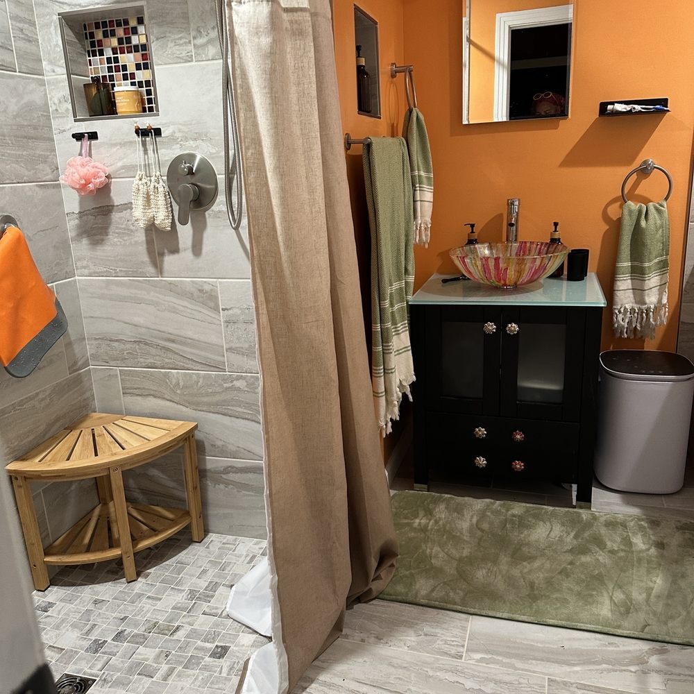 Triton Contracting Services - a bathroom with orange walls - General Contractors Near Me - Virginia Beach, Virginia Triton Contracting Services - a bathroom with orange walls - General Contractors Near Me - Virginia Beach, Virginia