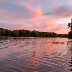 Riverwood Log Cabins - Sunset on the river.