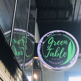 Green table serves hot dogs, burgers, & milkshakes Green table serves hot dogs, burgers, & milkshakes