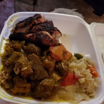 Caribbean Jerk Palace - Combo meal jerk chicken with curry Goat, cabbage - Caribbean Near Me - Chicago, Illinois