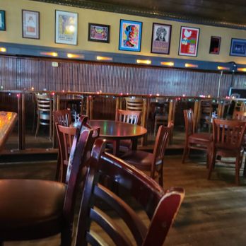 The Blue Monkey - a restaurant with tables and chairs - Bars Near Me - Memphis, Tennessee