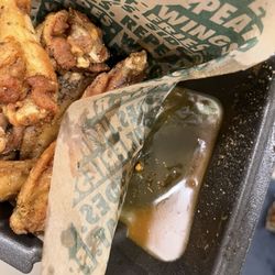 Wingstop - The grease that did not leak into the bag yet. It was enough to rinse the seasoning of most of the wings tho