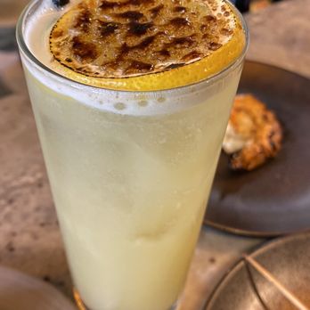 Izakaya Fishtown - Cocktail: Tea Time (Hojicha Tea-Infused Gin, house ginger & honey syrup, Chamomile, and a Flambé'd lemon) So good!! - Sushi Bars Near Me - Philadelphia, Pennsylvania Izakaya Fishtown - Cocktail: Tea Time (Hojicha Tea-Infused Gin, house ginger & honey syrup, Chamomile, and a Flambé'd lemon) So good!! - Sushi Bars Near Me - Philadelphia, Pennsylvania
