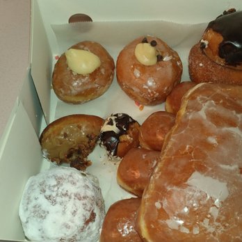 Legendary Doughnuts - Two bite donut balls + yogi bear on the bottom right and coastie on top. - Donuts Near Me - Issaquah, Washington Legendary Doughnuts - Two bite donut balls + yogi bear on the bottom right and coastie on top. - Donuts Near Me - Issaquah, Washington