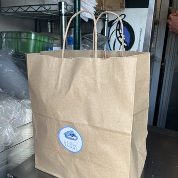 Cloud Sushi - a brown paper bag with a blue sticker on it - Sushi Bars Near Me - Truckee, California